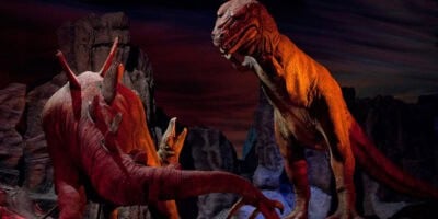 Tyrannosaurus rex and Stegosaurus Audio-Animatronics inside the Primeval World diorama on the Disneyland Railroad.
