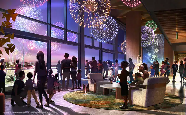 Guests at the resort lounge enjoy a spectacular fireworks show through expansive windows, with the themed nighttime display lighting up the sky outside.