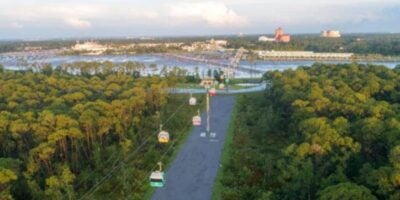 An aerial look at the Disney Skyliner with the Twilight Zone tower of terror in the distance