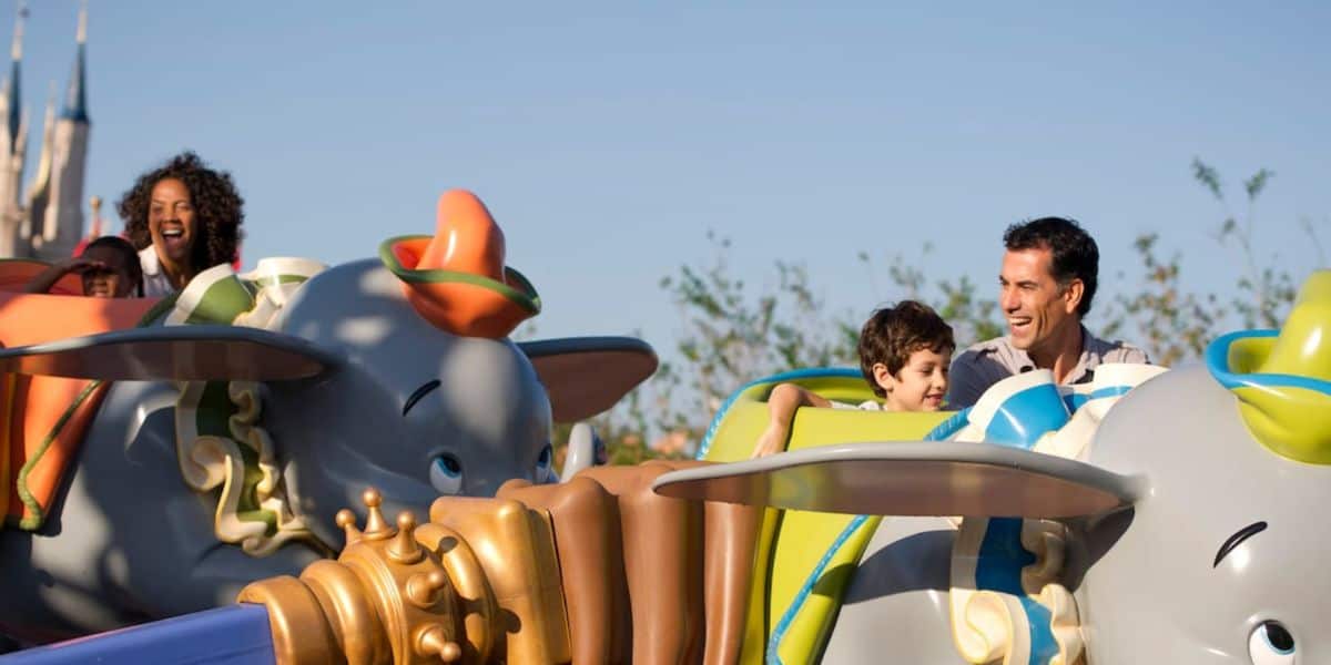 disney world guests ride dumbo at magic kingdom