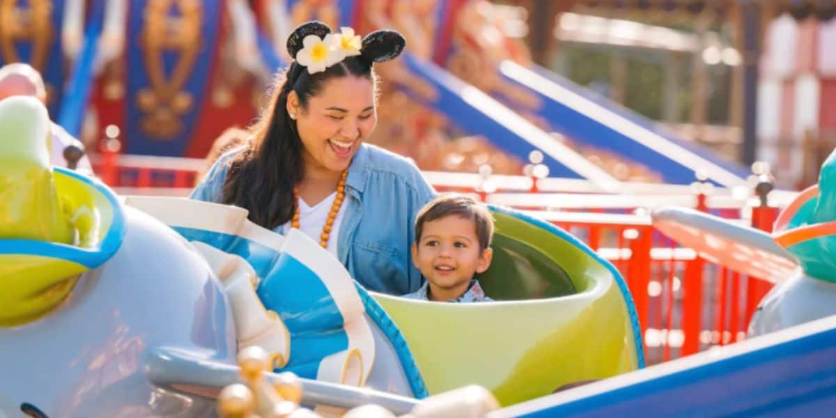 guests ride dumbo in disney world's magic kingdom park