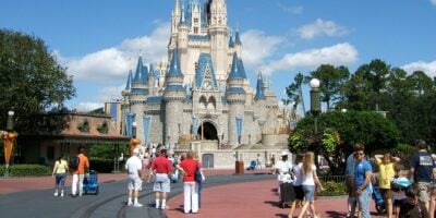 Guests in front of Cinderella Castle at Magic Kingdom in Disney World