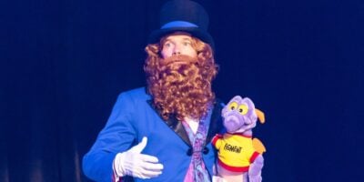 Neil Patrick Harris dressed up as Dreamfinder, holding Figment plush at D23 2026