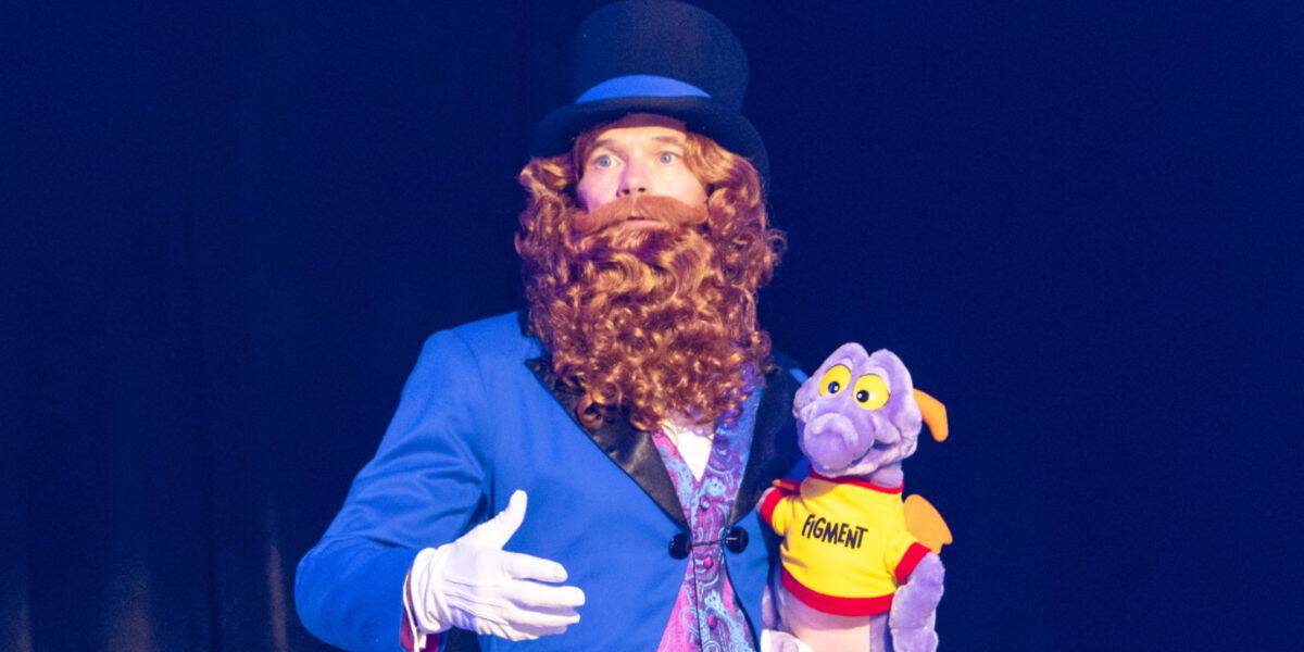 Neil Patrick Harris dressed up as Dreamfinder, holding Figment plush at D23 2026