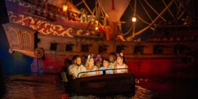 guests ride pirates of the caribbean in disney world's magic kingdom park