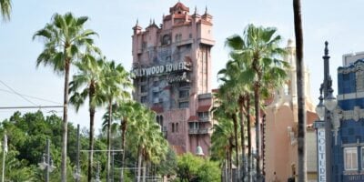 Palm trees line the street leading to the Twilight Zone Tower of Terror.