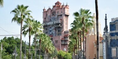 The Twilight Zone Tower of Terror framed by palm trees at Disney's Hollywood Studios.
