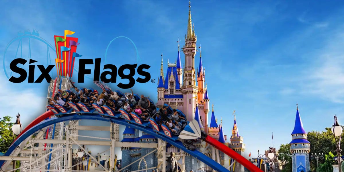 Six Flags roller coaster soaring over a magical castle, all set against a bright blue sky.
