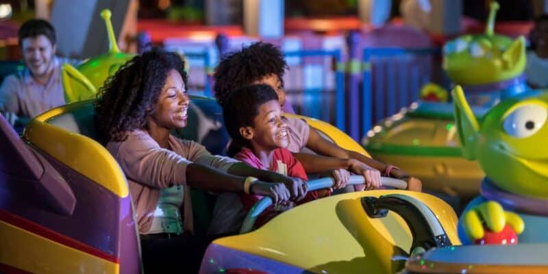 Guests enjoy Alien Swirling Saucers attraction in Toy Story Land