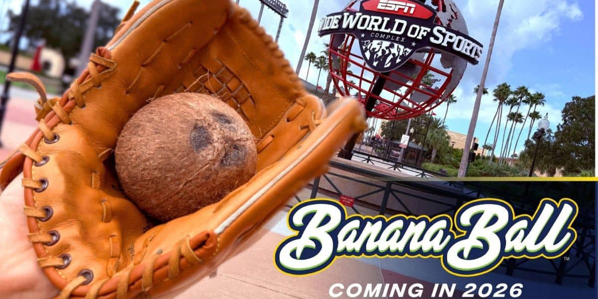 A baseball glove cradles a coconut in front of the ESPN Wide World of Sports Complex, spotlighting “Banana Ball” in lively text.