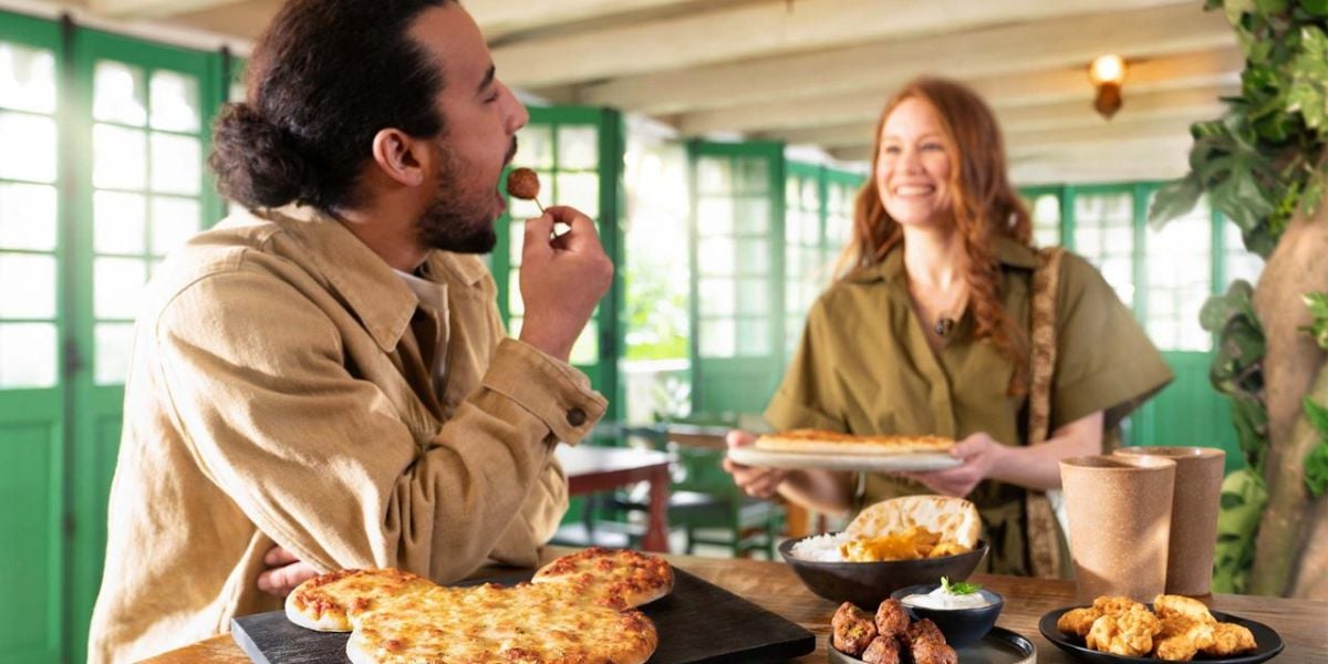 Guests enjoying Mickey-shaped pizza at Colonel Hathi's