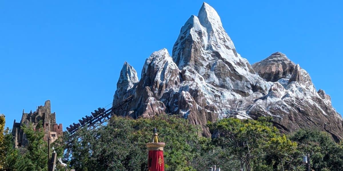 Expedition Everest at Disney's Animal Kingdom Theme Park in front of a clear blue sky.