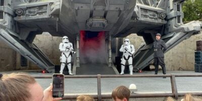 Star Wars stormtroopers and an Imperial officer pose on stage at Disney's Hollywood Studios
