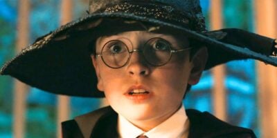 Dominic McLaughlin as Harry Potter trying on the Sorting Hat