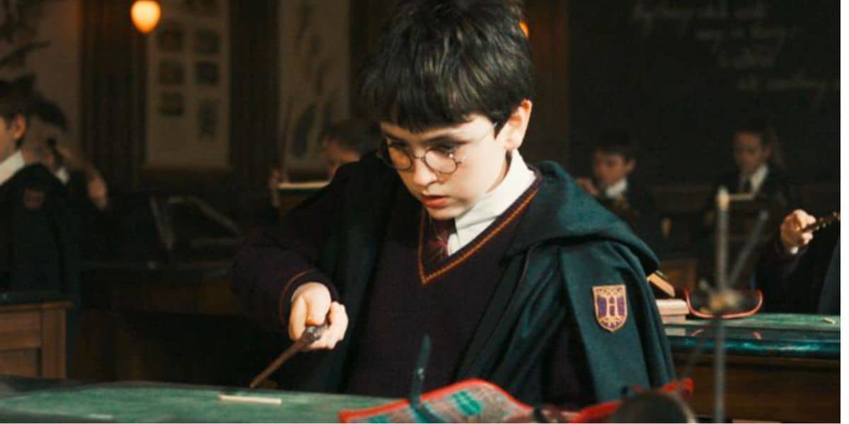 Harry Potter (Dominic McLaughlin) holding his wand in HBO series