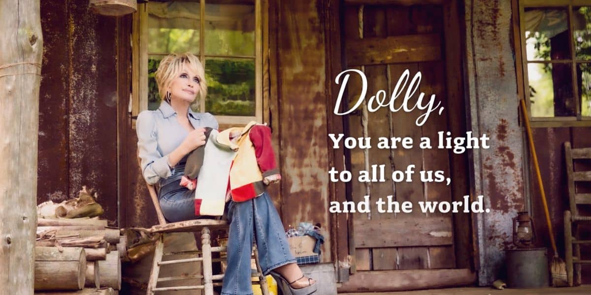 Dolly Parton sits on her front porch at Dollywood with text reading "Dolly, you are a light to all of us and the world" to honor her legacy