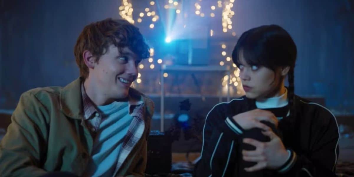 Tyler Galpin and Wednesday Addams watch a movie in 'Wednesday' Season 1 on Netflix
