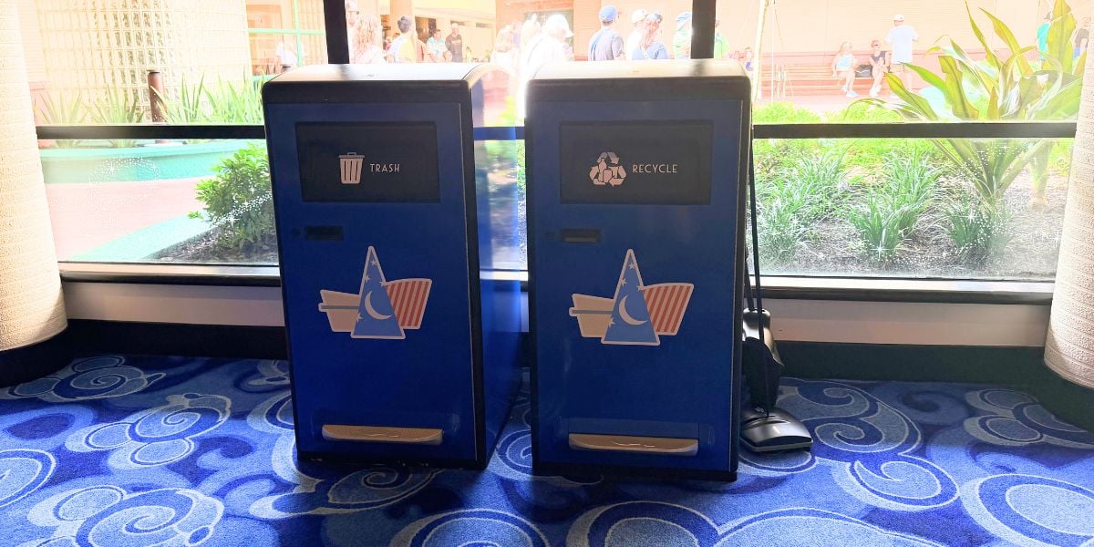 Blue solar trash and recycling bins with Sorcerer Mickey icons at Disney’s Contemporary Resort.
