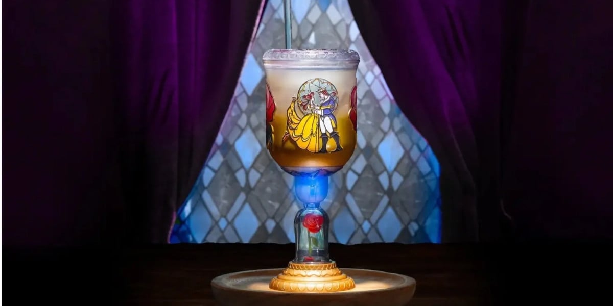 Beauty and the Beast stained glass goblet featuring an exclusive Disney World cocktail with a rose in the base.