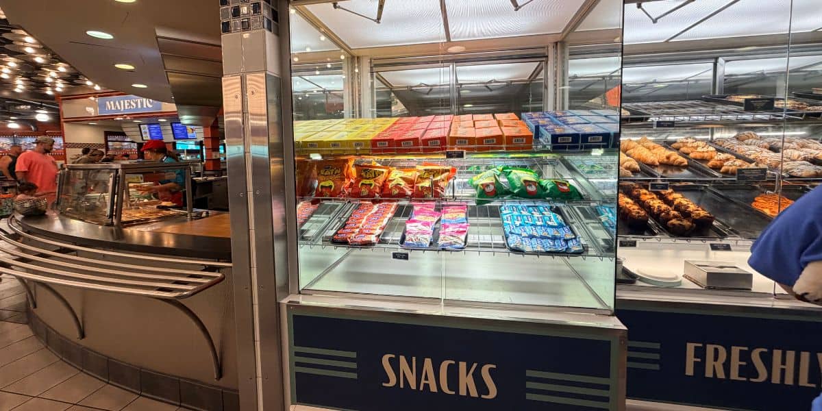 Display case of allergy-friendly snacks and pastries at an EPCOT quick-service location.