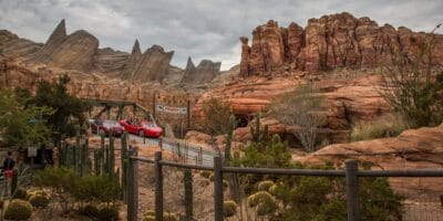 Cars cruising through Radiator Springs Racers in Cars Land at Disney California Adventure Park at Disneyland Resort.