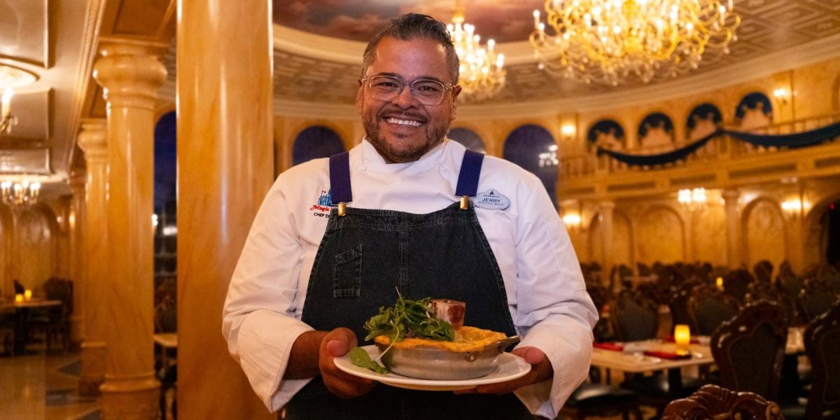 Chef de Cuisine Jerry presenting a dish at Be Our Guest Restaurant in Magic Kingdom.