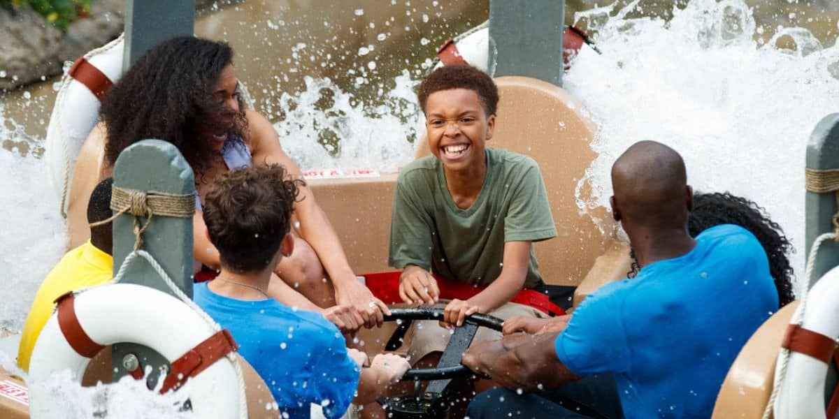 A family getting splashed on Smoky Mountain River Rampage