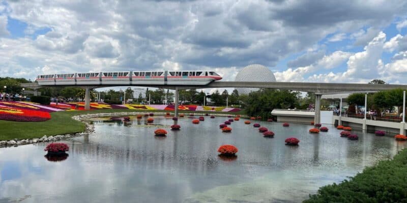 The Disney Monorail gliding past Spaceship Earth at Epcot during the International Flower & Garden Festival.