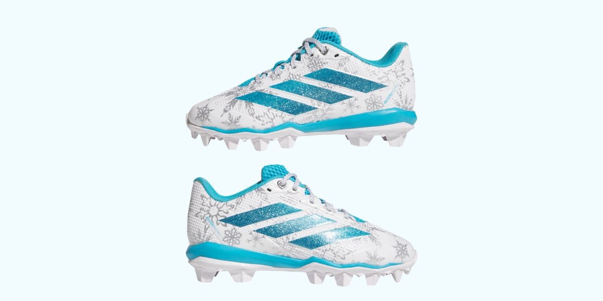 Frozen 3 cleats featuring a white and blue snowflake pattern with glittery blue stripes.