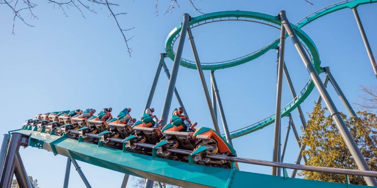 Goliath roller coaster with orange track and green supports at Six Flags Over Georgia.