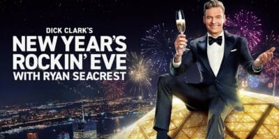 Ryan Seacrest toasts with champagne atop the Times Square ball for Dick Clark’s New Year’s Rockin’ Eve.