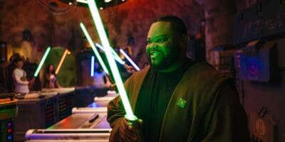A guest building a lightsaber in Savi's Workshop