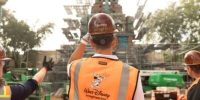 Disney Imagineers in front of indiana jones ride construction at animal kingdom